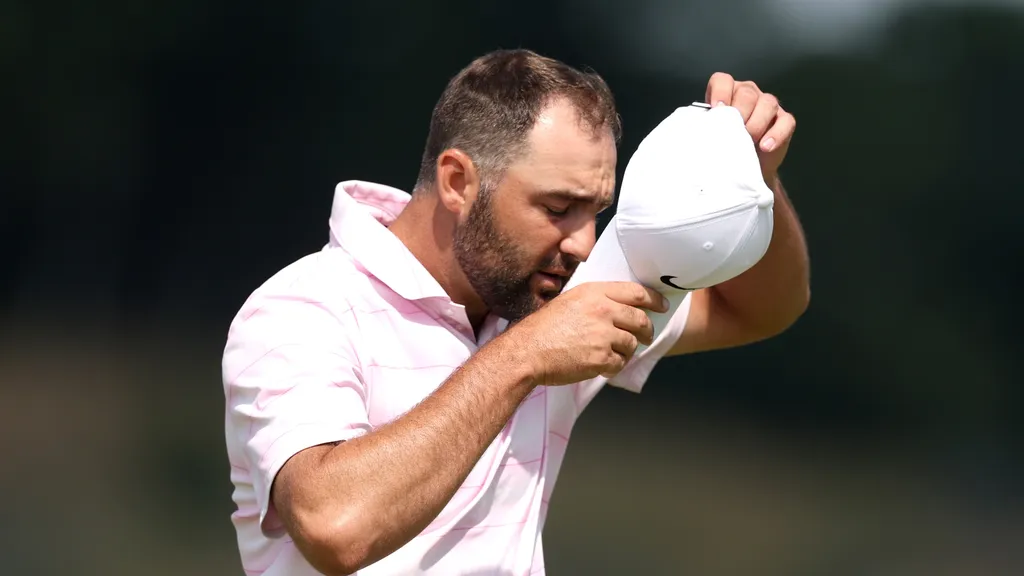Scottie Scheffler removing his cap on the course at the Scottish Open